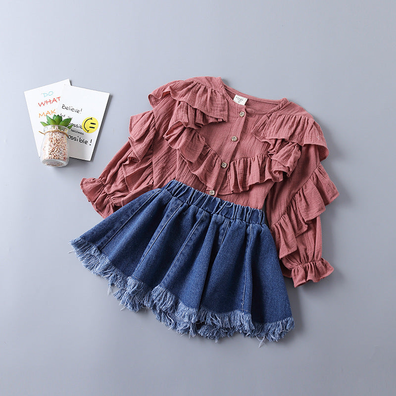 Children's Clothing In a Shirt And Denim Skirt